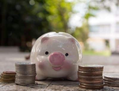 Piggy bank surrounded by coins