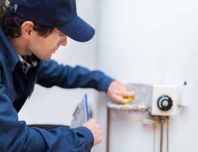 Technician working on a boiler