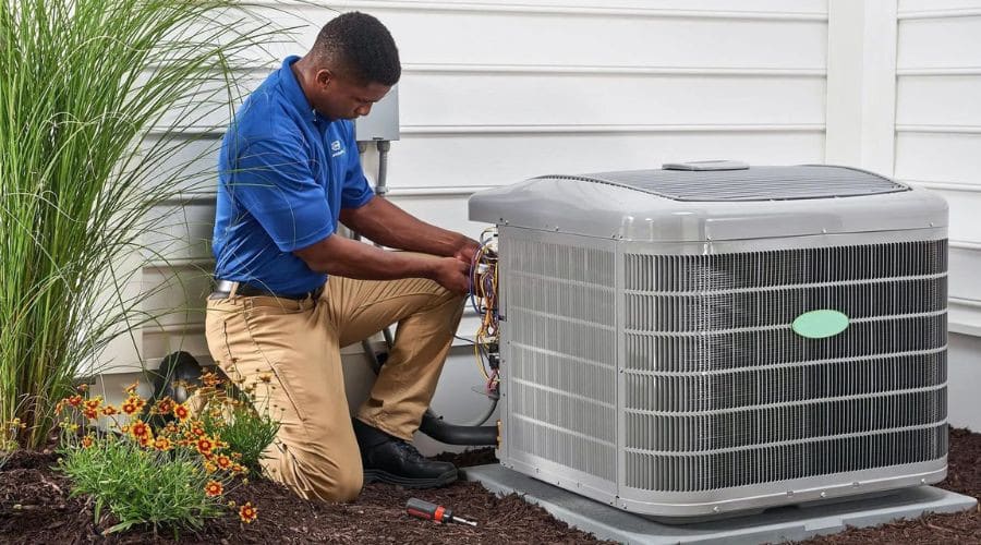 HVAC Tech working on a heating and cooling unit from RCL Mechanical