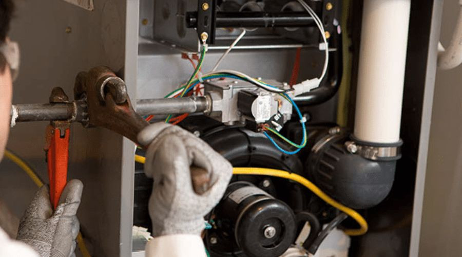 RCL Mechanical repairing a gas furnace in a Middleboro are home